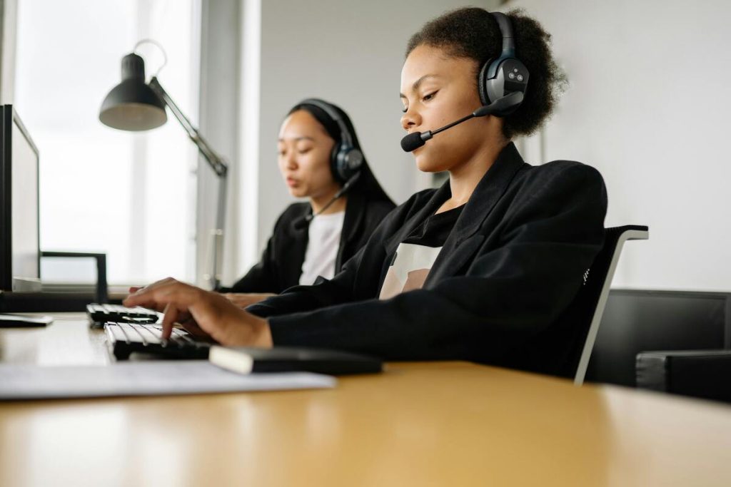 Call center agents engaged in omnichannel customer support for global clients.