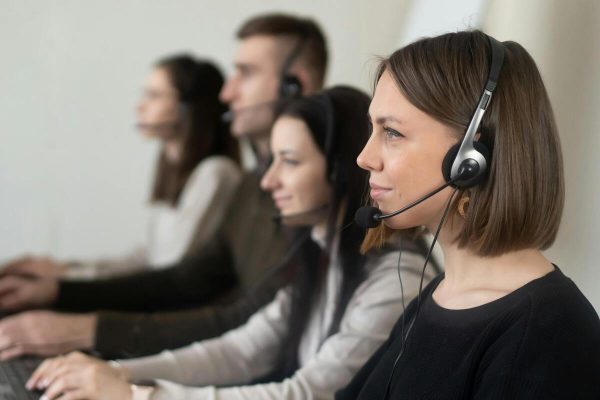 Call center agents providing customer service outsourcing for small business