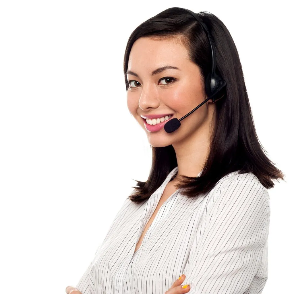 Smiling customer service agent wearing a headset against a white background