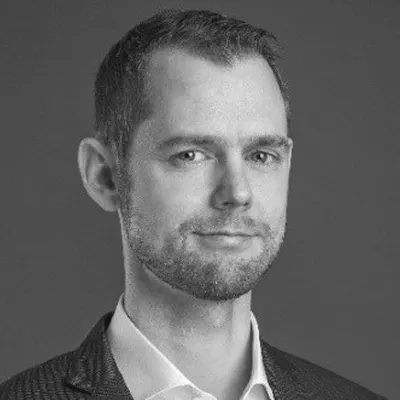 Formal headshot of a corporate professional in business attire